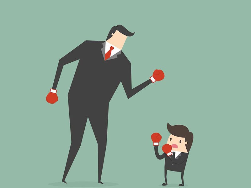 Protester with megaphone facing a crowd